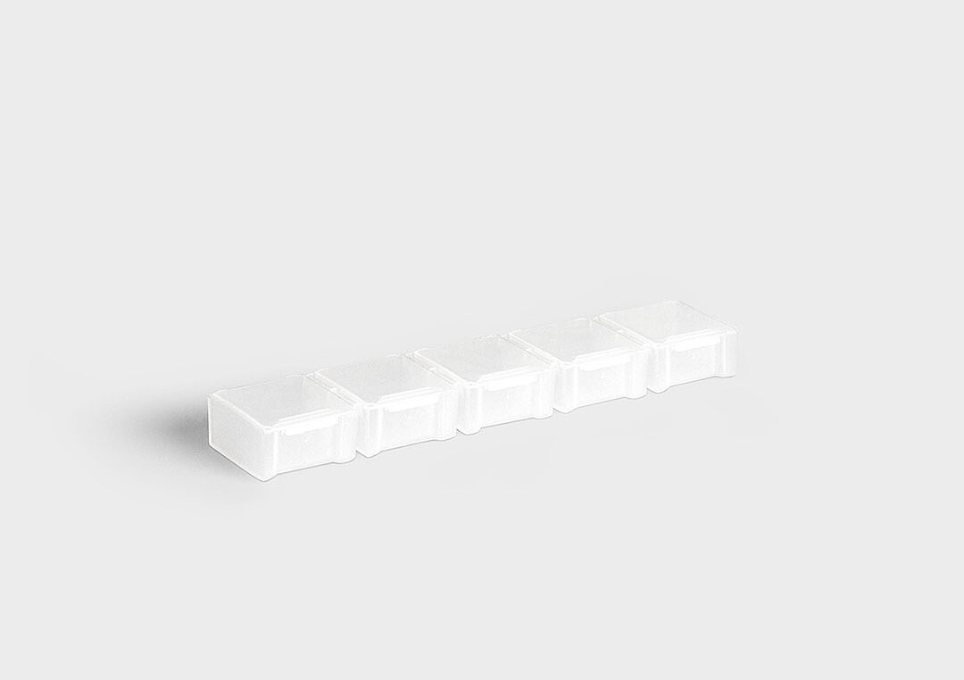 InsertSplitBox: um sistema de embalagem múltipla com compartimentos individuais destacáveis.
